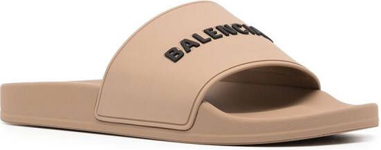 Balenciaga logo-embossed pool slides Brown
