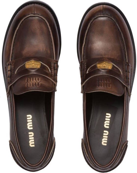 Miu logo-embossed leather penny loafers Brown