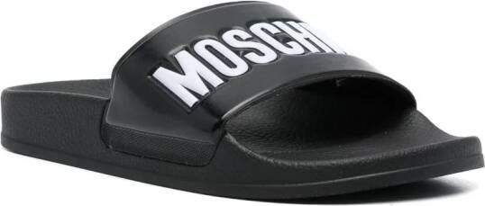 Moschino embossed-logo flat slides Black