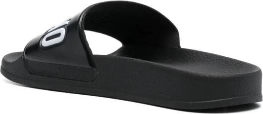Moschino embossed-logo flat slides Black
