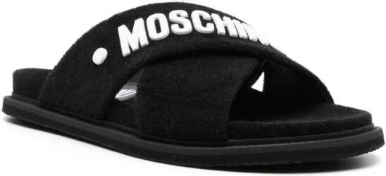 Moschino logo-embossed crossover-strap sandals Black