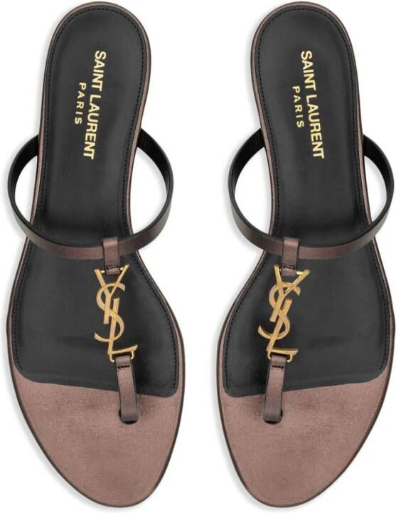 Saint Laurent Cassandra leather flip flops Brown