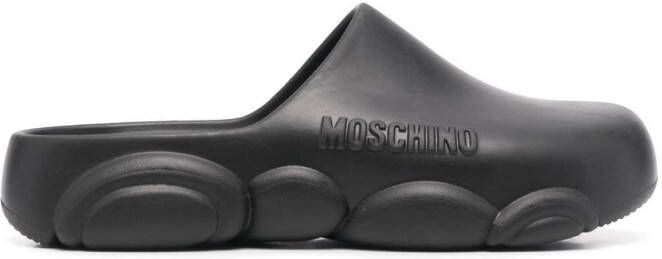Moschino logo embossed mules Black