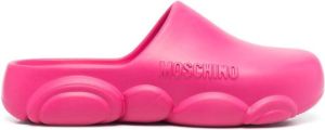 Moschino logo embossed mules Pink