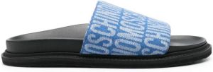 Moschino logo-pattern flat slides Blue