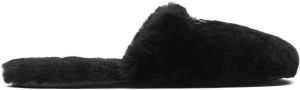 Prada logo-plaque shearling slippers Black